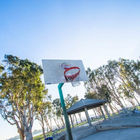 Basketball court surrounded by trees at Embarcadero Marina Park South at the Port of San Diego