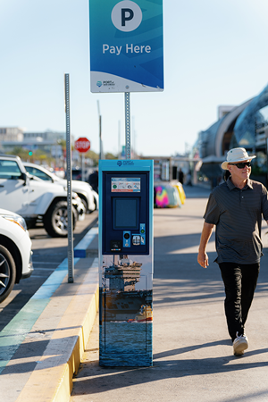 a parking pay station with a colorful picture on it