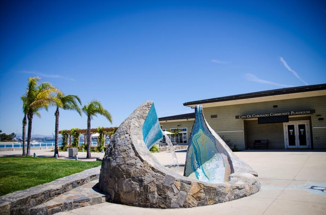 a mosaic fountain by the artist James T. Hubbell rises from the concrete and has blue tone tiles on the inside