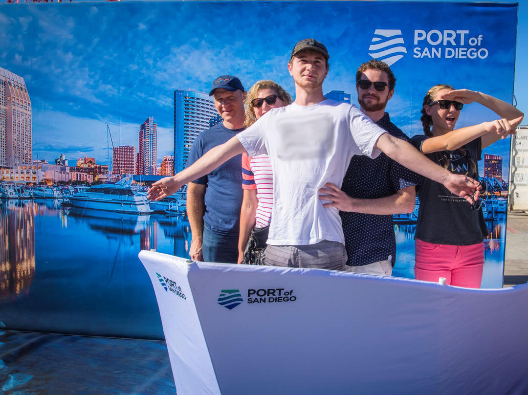 a group of people take a fun photo in the Port of San Diego Dream Booth