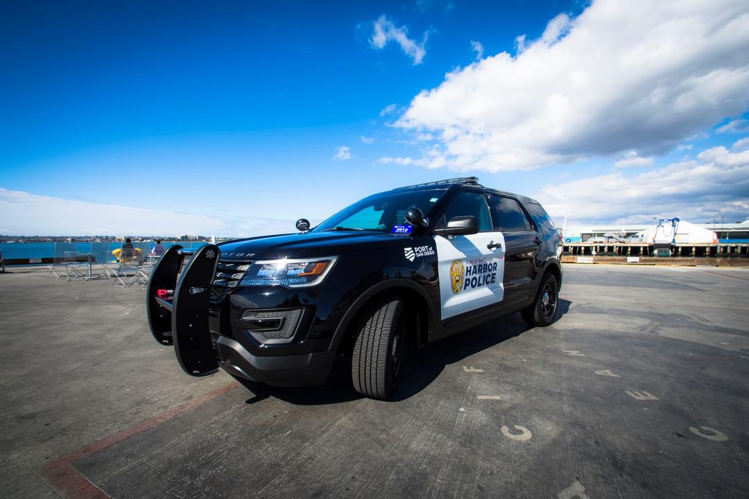a Harbor Police SUV sits in a parking lot.