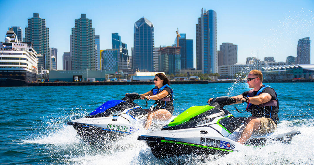 Embarcadero Experience Jetskis - a couple dart about the San Diego Bay on rented jetskis