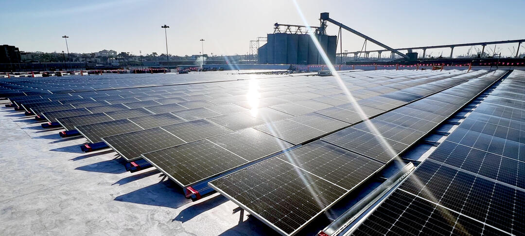 rows of black solar panels on a roof at Tenth Avenue Marine Terminal