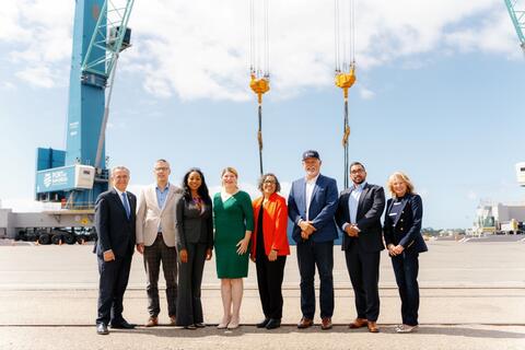 State and local leaders during a tandem-lift demonstration of the Port of San Diego's new all-electric mobile harbor cranes on September 17, 2024.