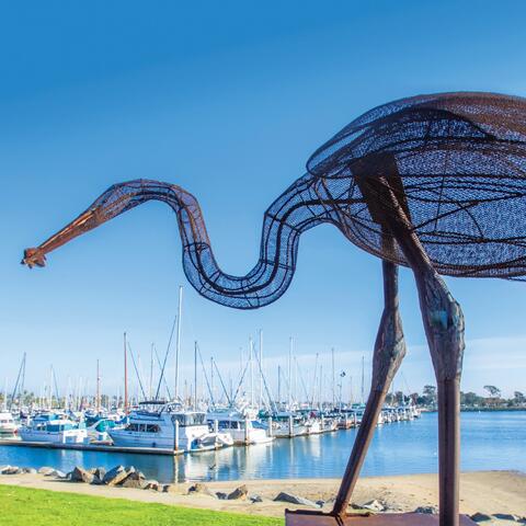 A sculpture of a bird made out of metal overlooks the Chula Vista Marina