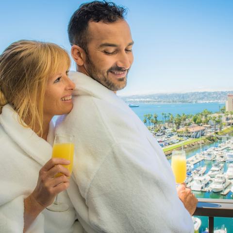 Harbor Island -a couple has breakfast on the balcony Port of San Diego