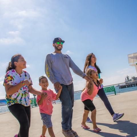 Family enjoying the recreational pier at Cesar Chavez Park at the Port of San Diego