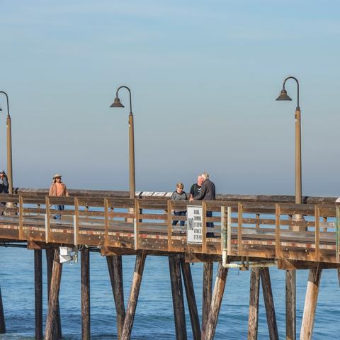 People walking over the pier at Portwood Pier Plaza at the Port of San Diego