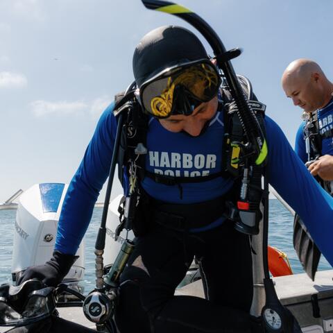 two Harbor Police officers in dive gear
